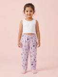Girl in lavender cotton pajama pants with a purple heart and sports racket print pattern.