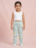 Toddler girl wearing mint green cotton pajama pants with a white bunny and yellow floral print.