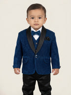 Baby boy wearing royal blue premium formal suit set with textured blazer, black pants, bow tie, and waistcoat for partywear occasions.