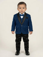 Baby boy wearing navy blue premium formal suit set with matching blazer and pants, white shirt, red bow tie, and pocket square for partywear occasions.