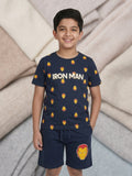 Young boy smiling in a navy blue two-piece cotton set featuring an Iron Man printed t-shirt and matching shorts with a large Iron Man mask graphic.
