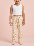 Toddler girl in soft peach cotton pajama pants featuring a cute yellow duck and chick pattern.